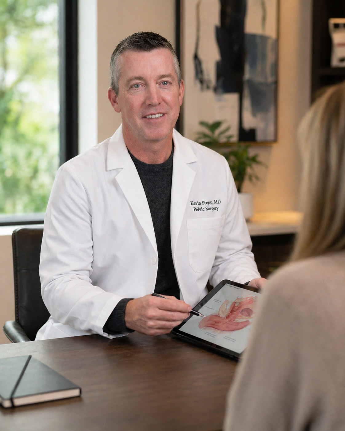 Dr. Kevin Stepp, MD, FACOG, URPS consulting with a patient — Advanced Pelvic Surgery and Urogynecology of Charlotte, NC